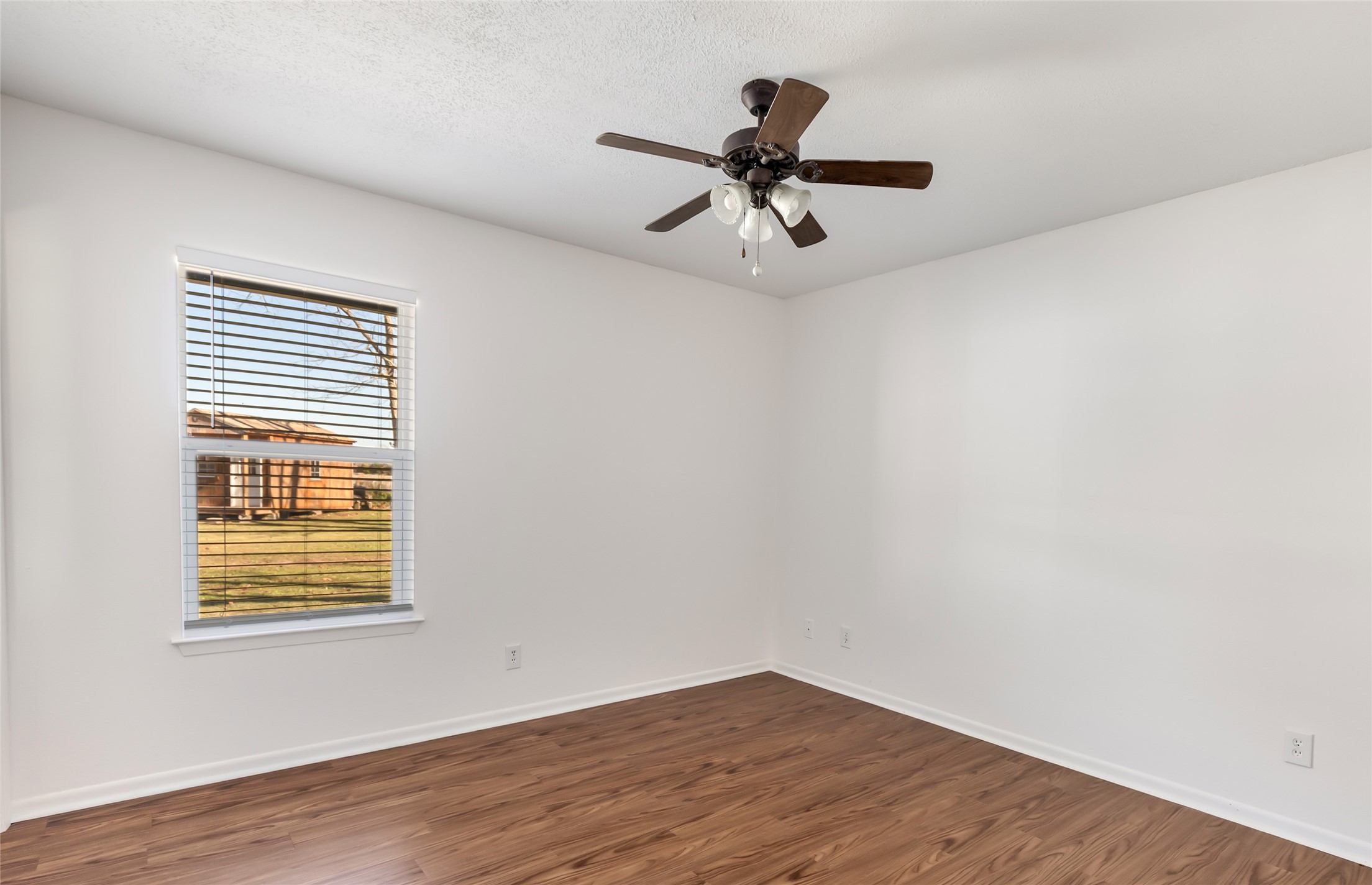 4019 Hillcrest Street Liberty, TX 77575 - Photo 13 of 31 a view of a room with wooden floor and windows