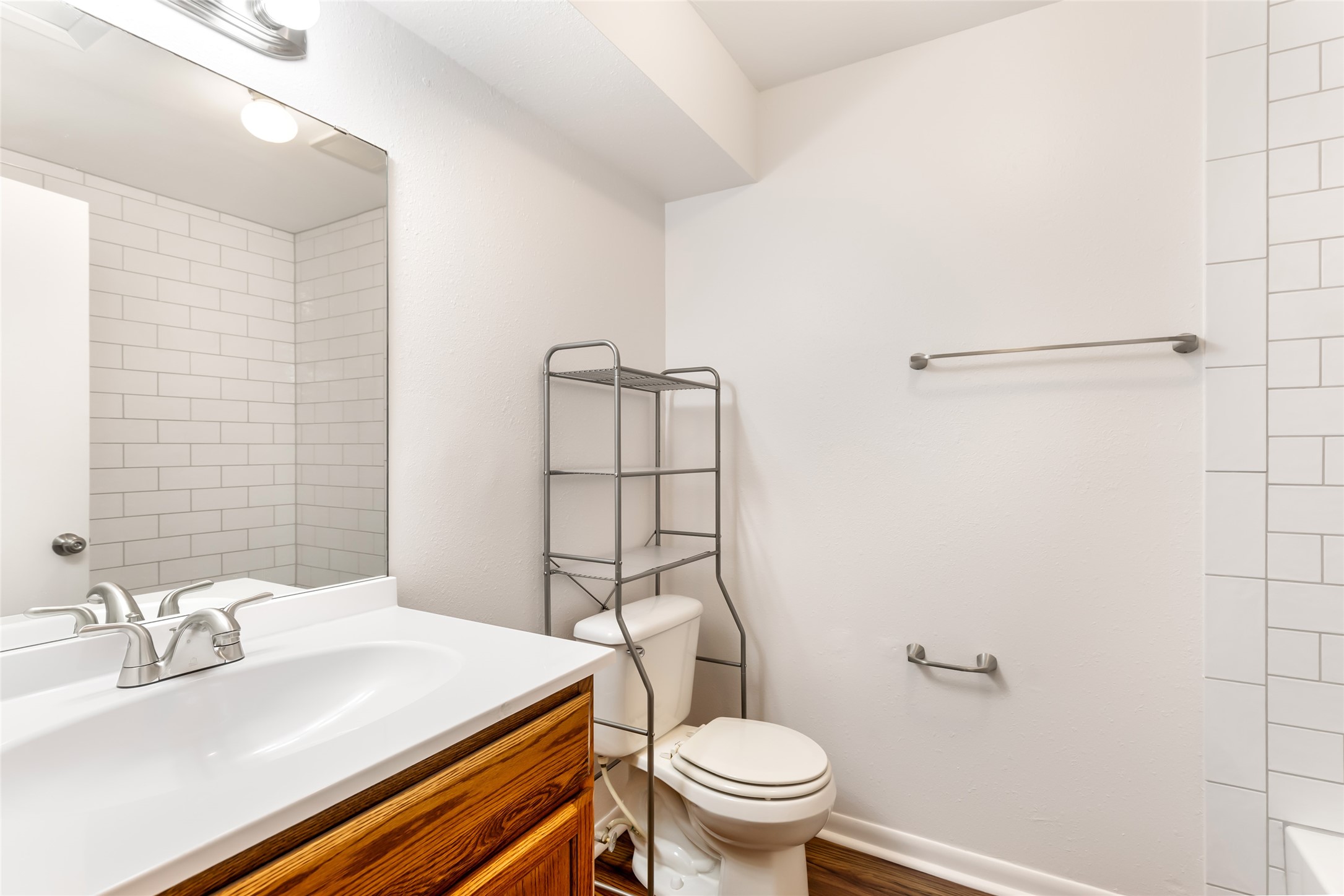 4019 Hillcrest Street Liberty, TX 77575 - Photo 14 of 31 a bathroom with a sink toilet and shower