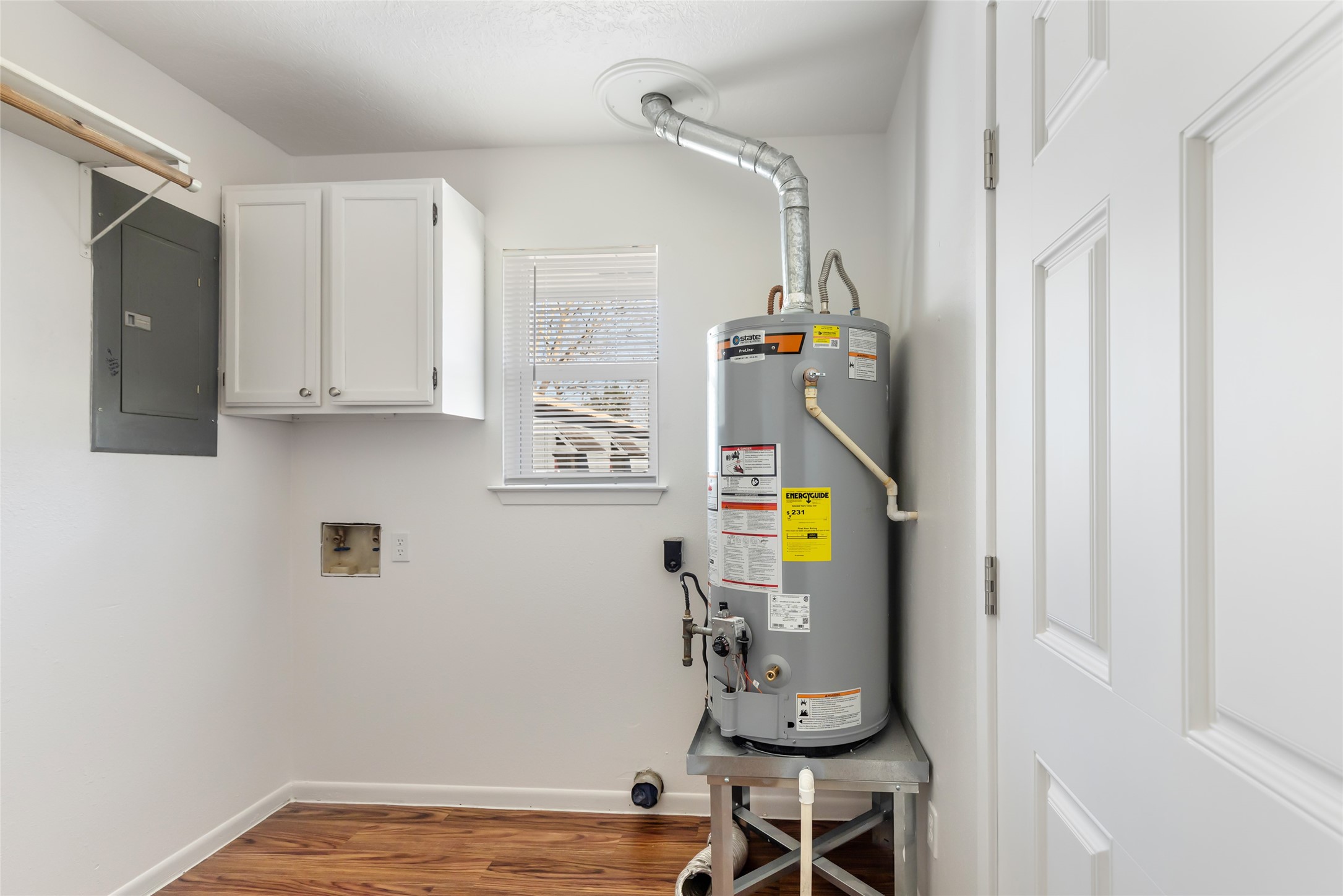 4019 Hillcrest Street Liberty, TX 77575 - Photo 16 of 31 a view of dining room with wooden floor and cabinets