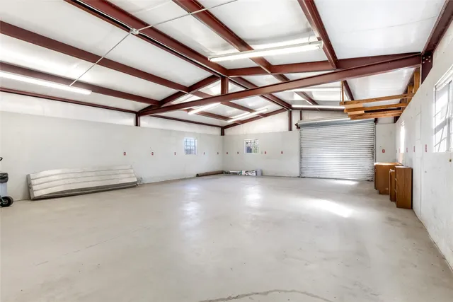 a view of dining room with wooden floor and cabinets