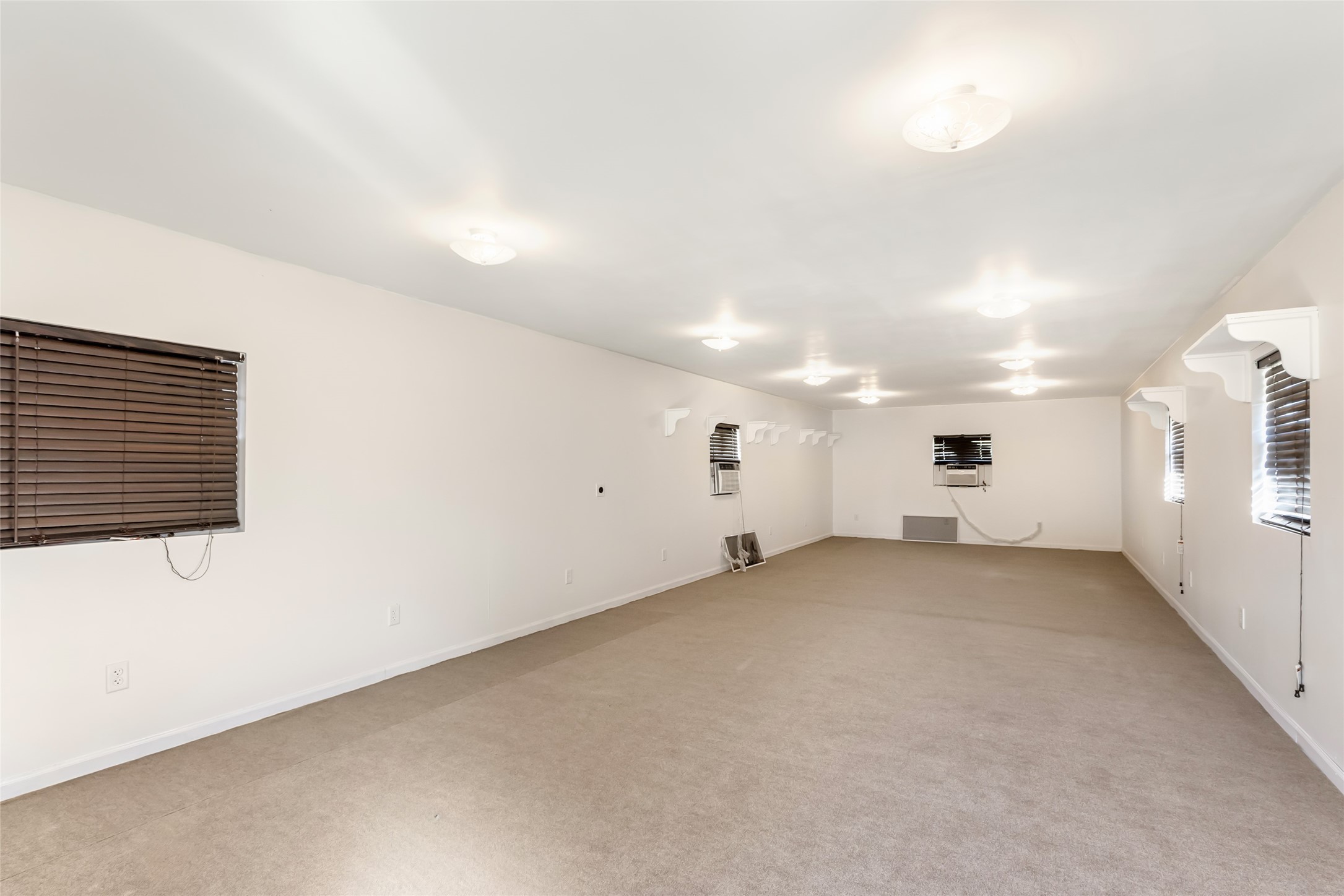 4019 Hillcrest Street Liberty, TX 77575 - Photo 20 of 31 an empty room with a white wall and windows