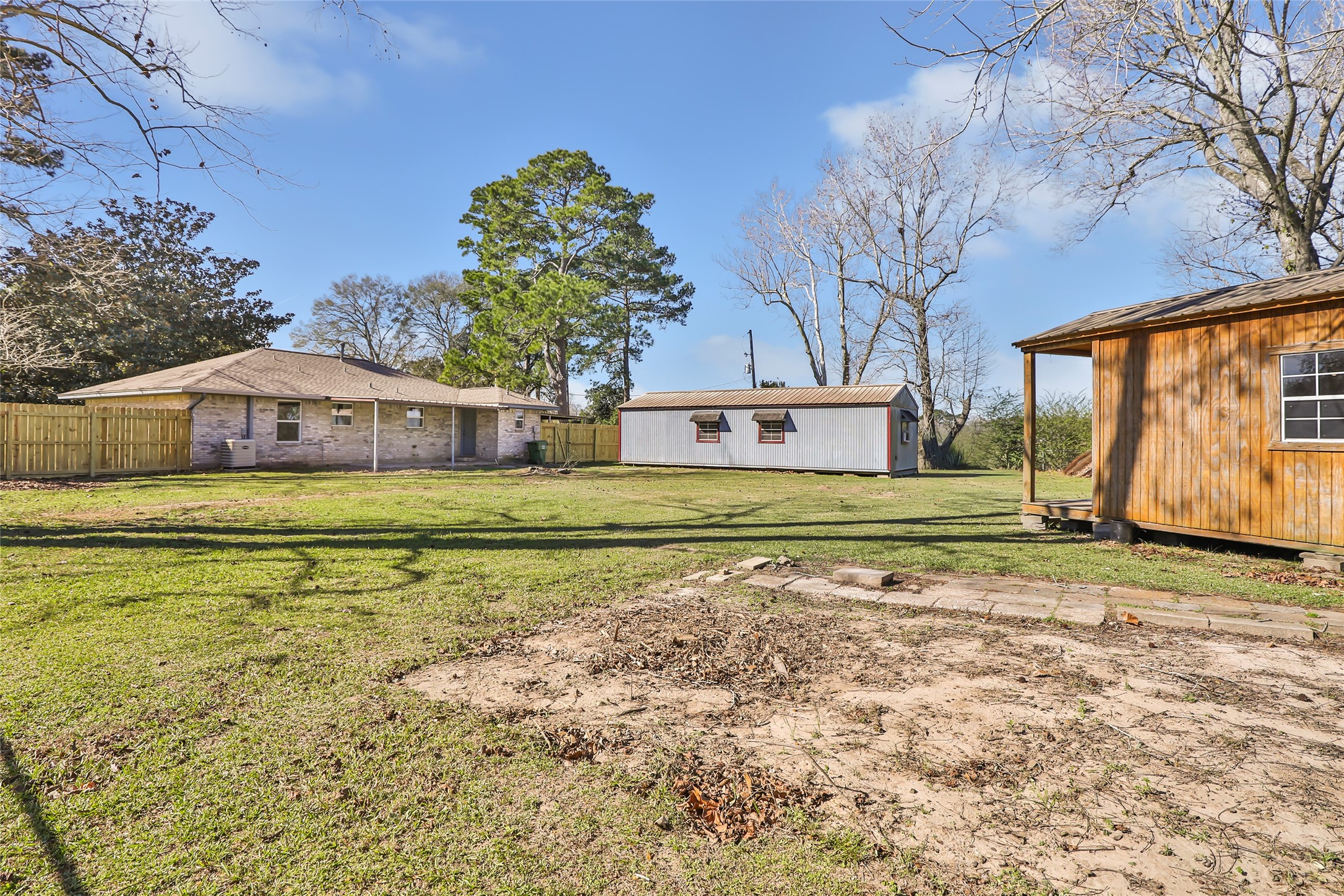 4019 Hillcrest Street Liberty, TX 77575 - Photo 25 of 31 a front view of a house with a yard