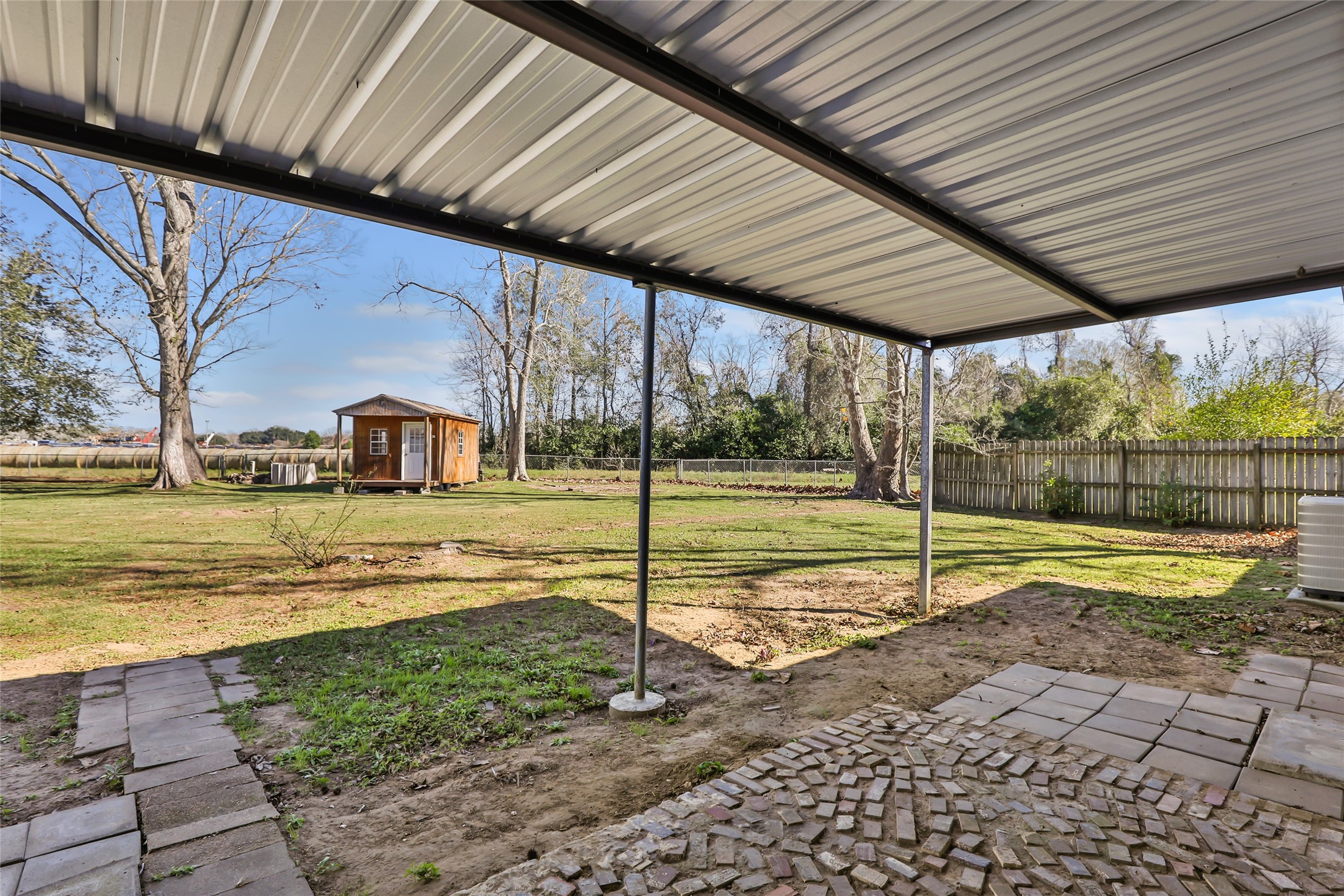 4019 Hillcrest Street Liberty, TX 77575 - Photo 28 of 31 a view of a house with a backyard
