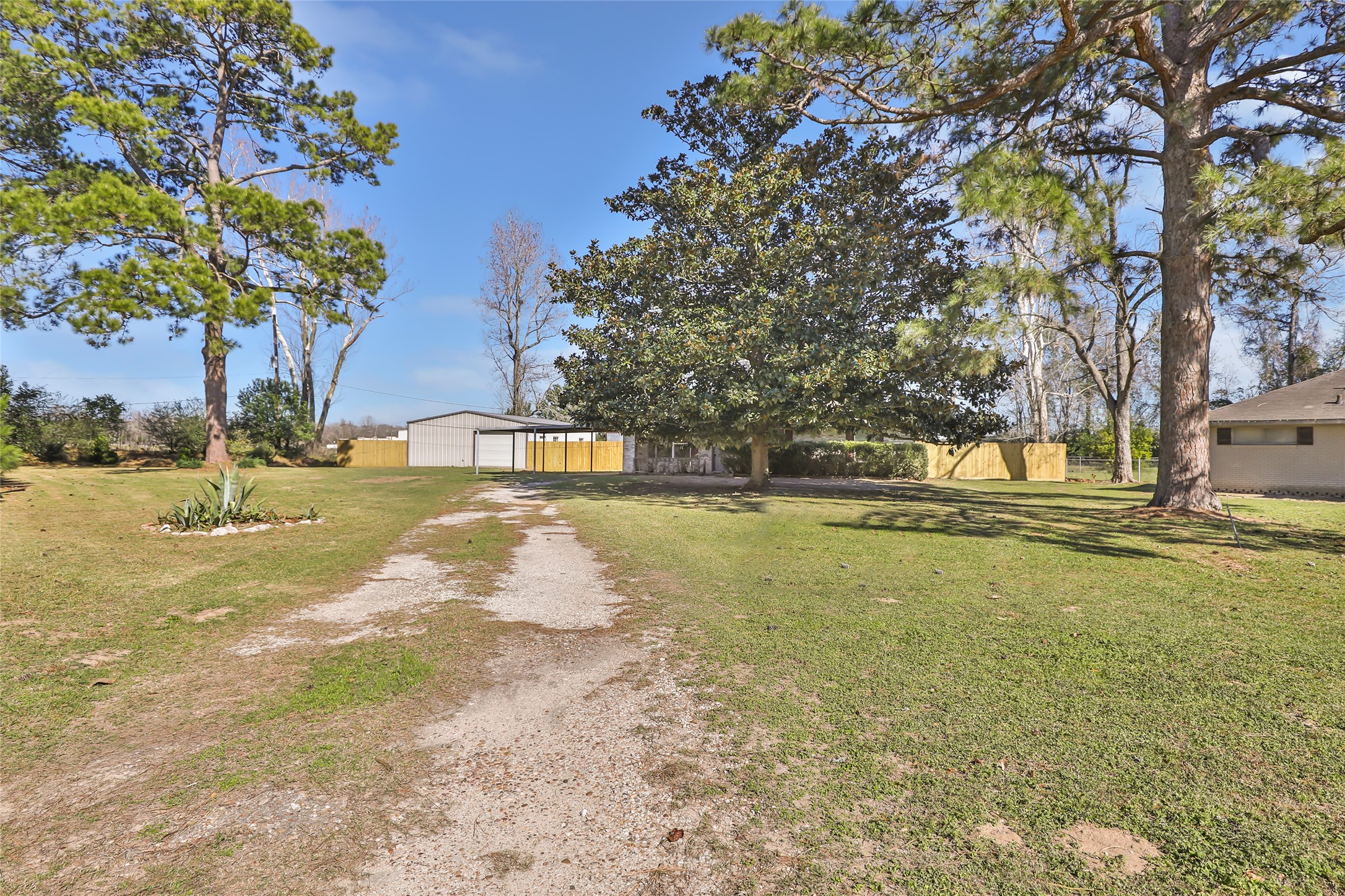 4019 Hillcrest Street Liberty, TX 77575 - Photo 3 of 31 a view of a yard with swimming pool