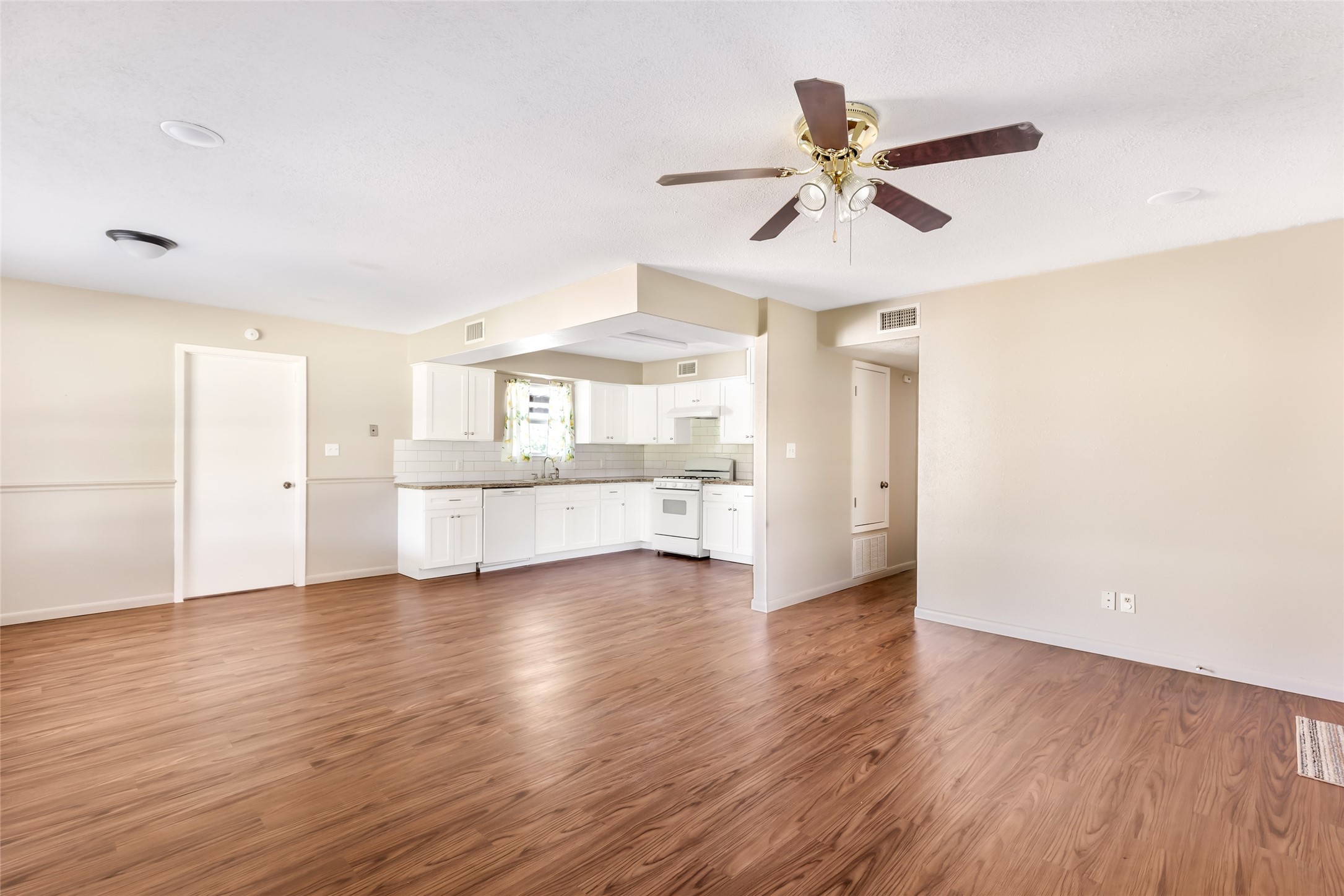 4019 Hillcrest Street Liberty, TX 77575 - Photo 5 of 31 a view of an empty room with window and wooden floor