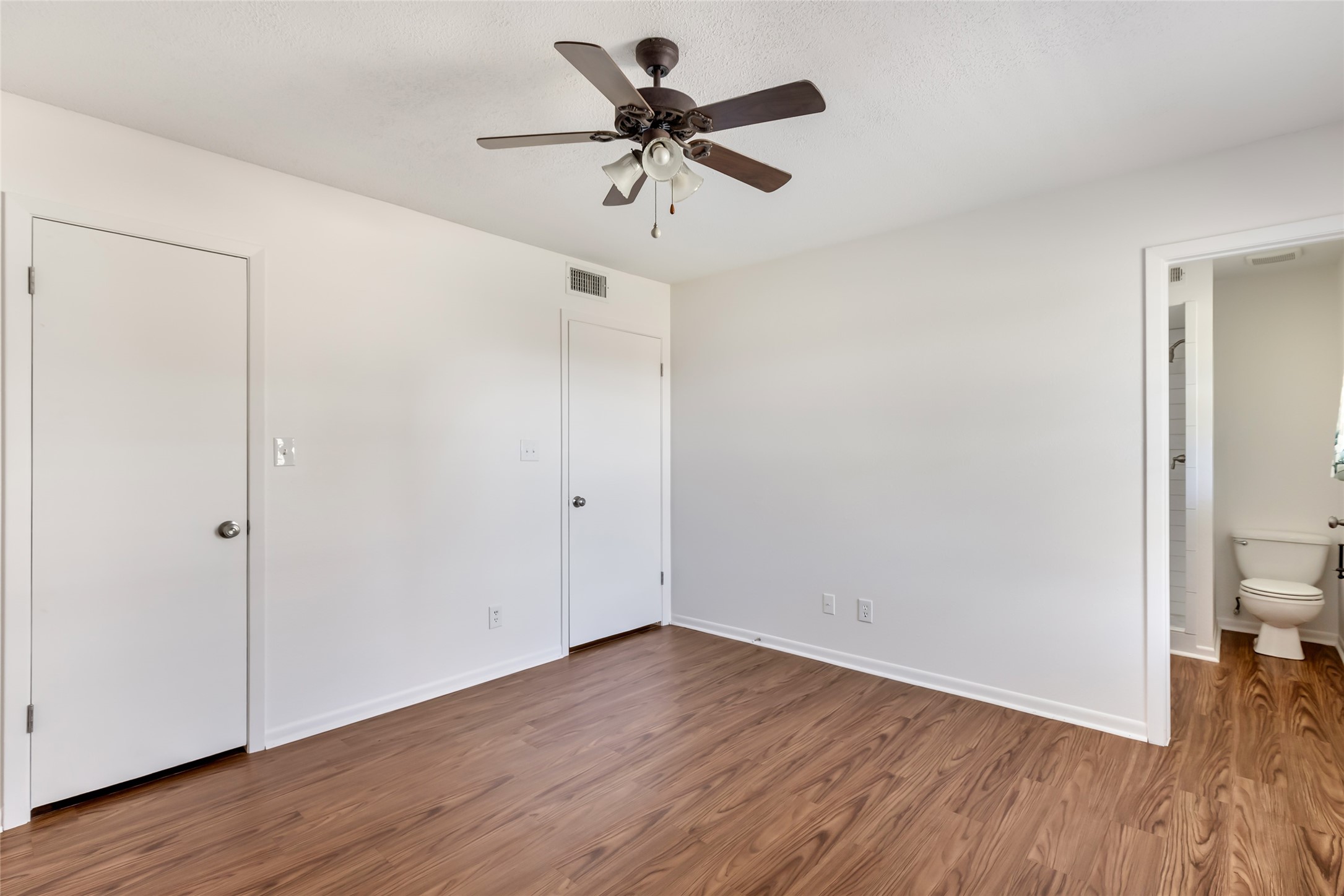 4019 Hillcrest Street Liberty, TX 77575 - Photo 9 of 31 a view of an empty room with wooden floor