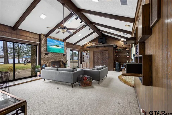 a living room with furniture and a large window