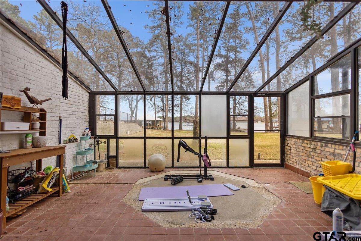 16835 Cardinal Lane Troup, TX 75789 - Photo 16 of 48 a reading room with furniture and a floor to ceiling window