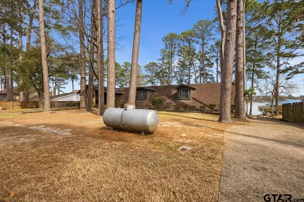 a view of a house with snow on the road