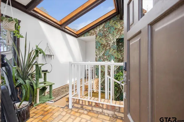 a bedroom with furniture and a fireplace