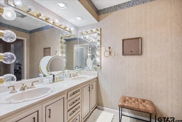 a living room with furniture fireplace and a large window