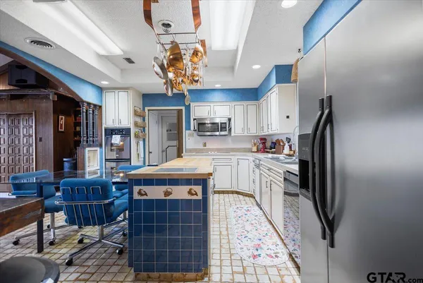 a utility room with sink dryer and washer
