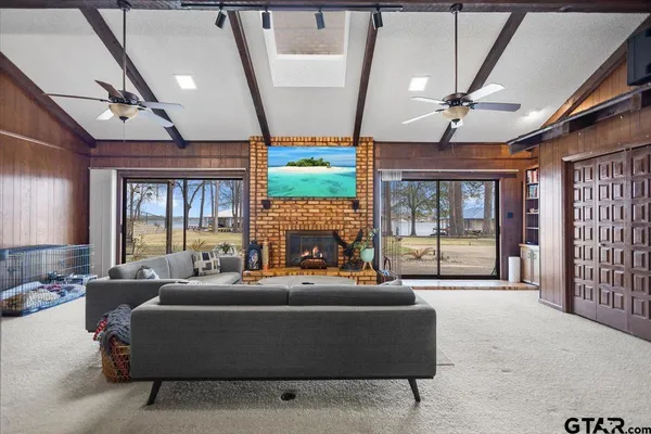 a swimming pool with outdoor seating and yard