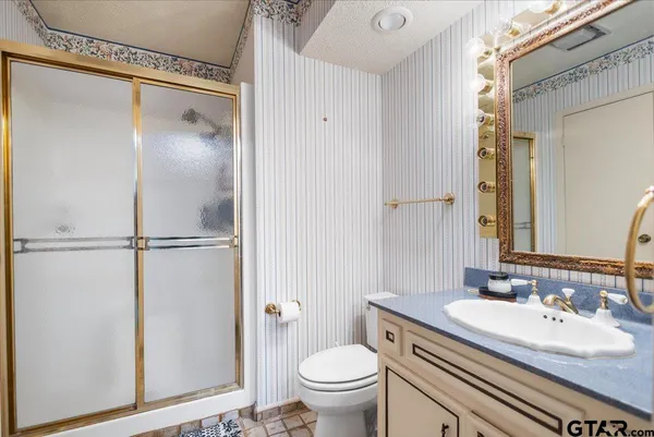 a swimming pool with outdoor seating and yard