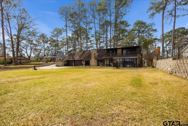 a view of road with large trees