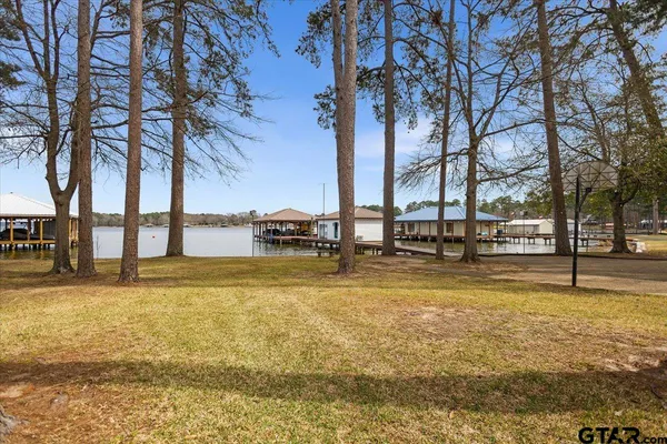 a view of a swimming pool with chairs in patio