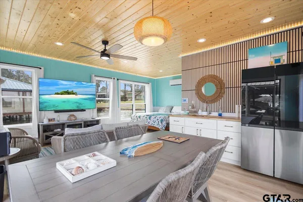 a bedroom with a large bed and a large window