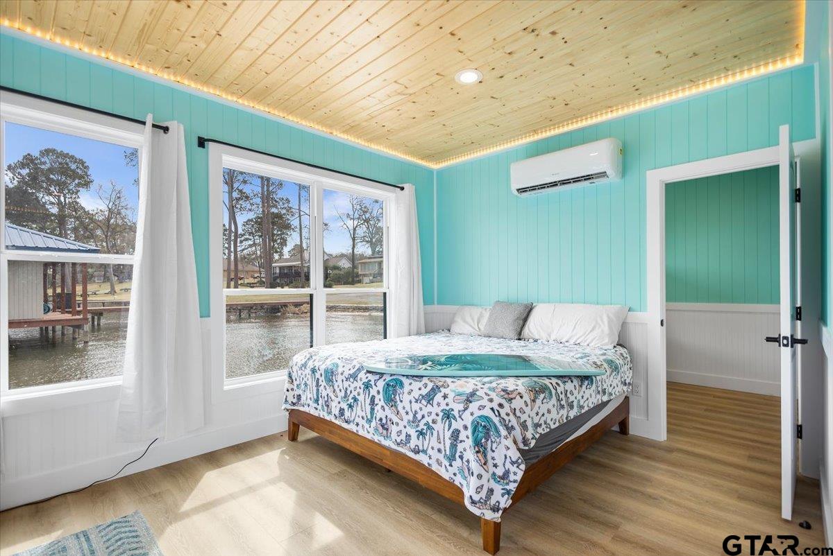 16835 Cardinal Lane Troup, TX 75789 - Photo 43 of 48 a bedroom with a bed and a large window