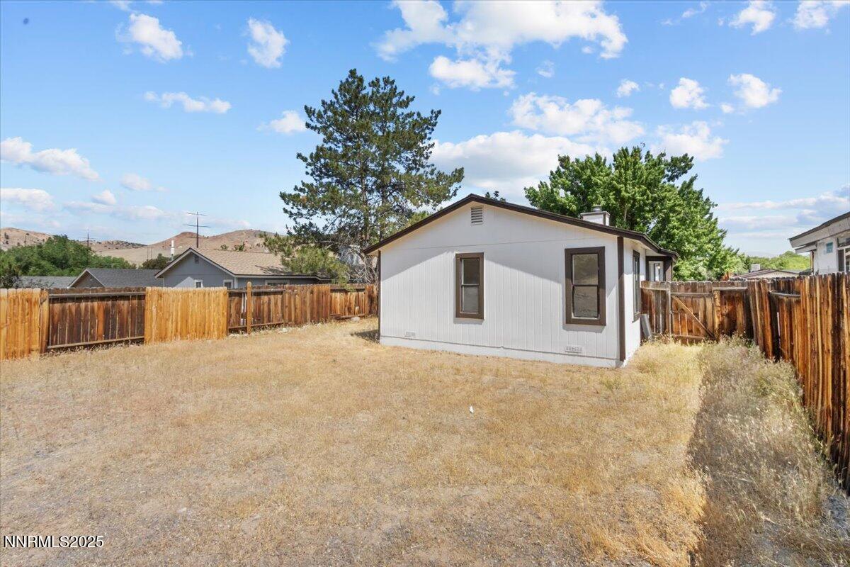 4830 Rampion Way Sun Valley, NV 89433 - Photo 22 of 30 a view of a house with a yard