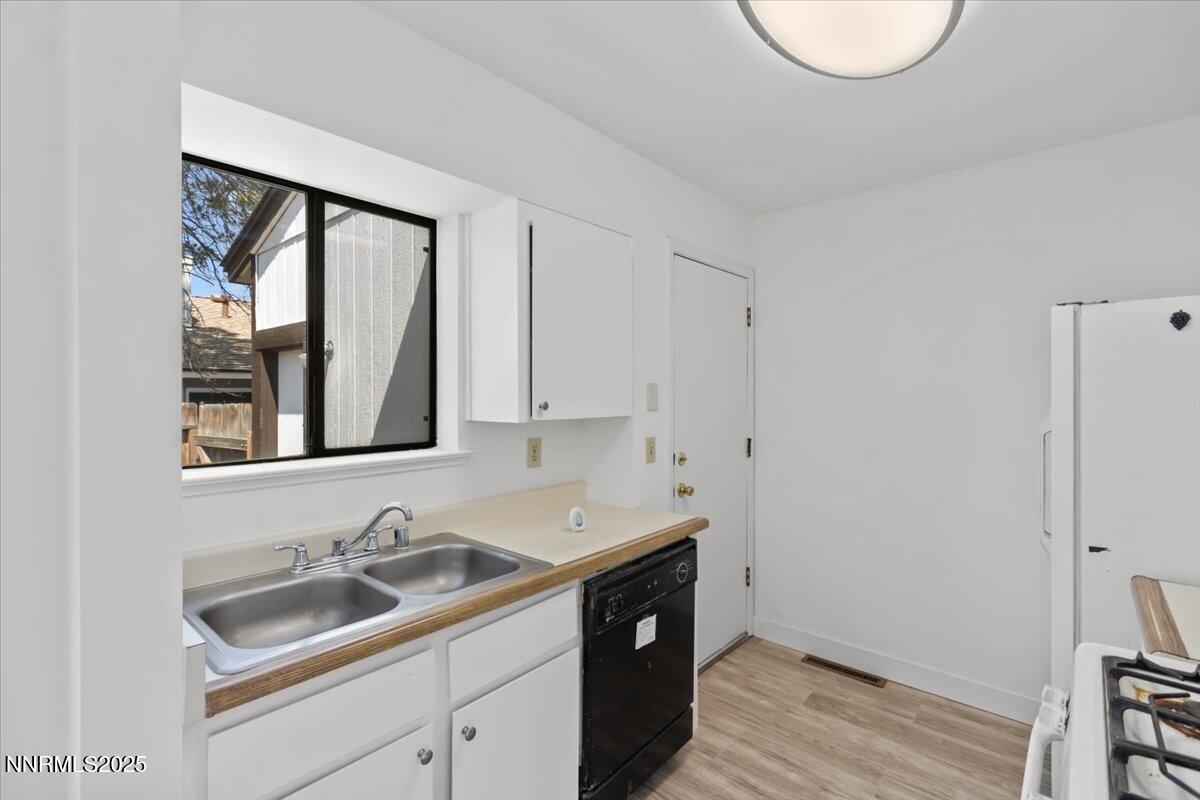 4830 Rampion Way Sun Valley, NV 89433 - Photo 8 of 30 a bathroom with a sink and a window