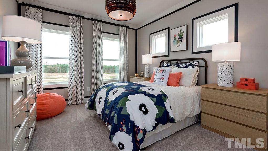 6940 Leesville Road, Unit 10 Raleigh, NC 27613 - Photo 12 of 38 a bedroom with a bed and a window