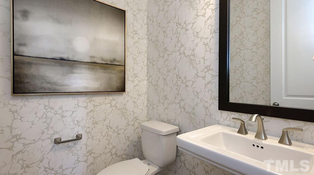 6940 Leesville Road, Unit 10 Raleigh, NC 27613 - Photo 14 of 38 a bathroom with a sink and a mirror