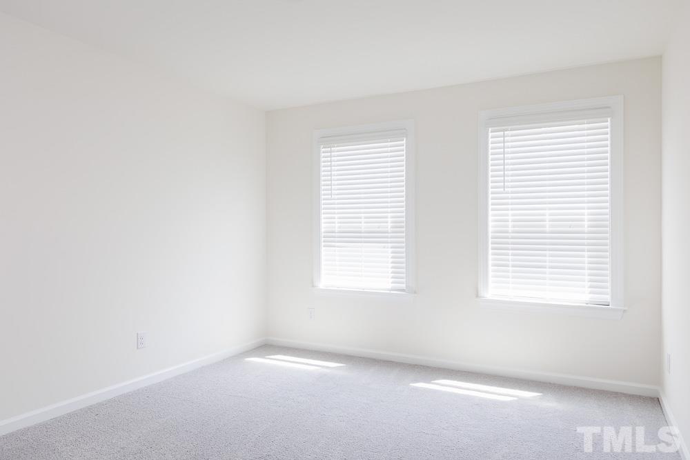 6940 Leesville Road, Unit 10 Raleigh, NC 27613 - Photo 22 of 38 an empty room with a window