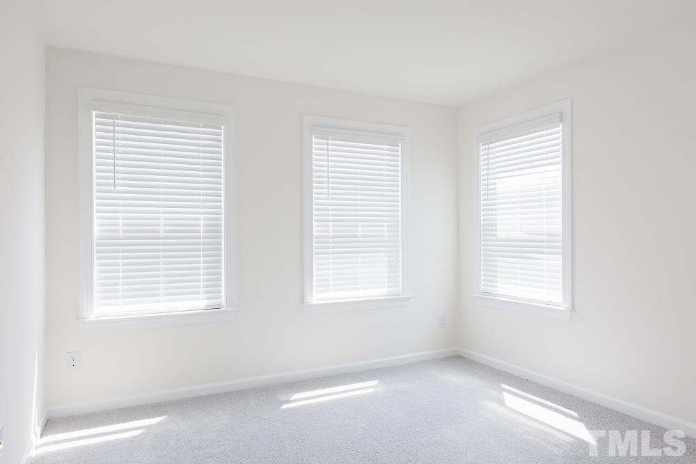 6940 Leesville Road, Unit 10 Raleigh, NC 27613 - Photo 24 of 38 a view of an empty room with a window