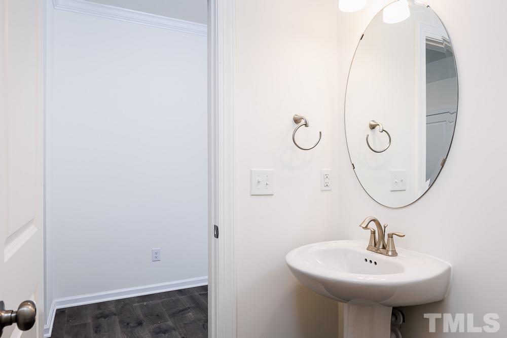 6940 Leesville Road, Unit 10 Raleigh, NC 27613 - Photo 31 of 38 a bathroom with a sink and a mirror