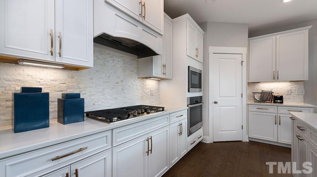 6940 Leesville Road, Unit 10 Raleigh, NC 27613 - Photo 6 of 38 a kitchen with cabinets and appliances