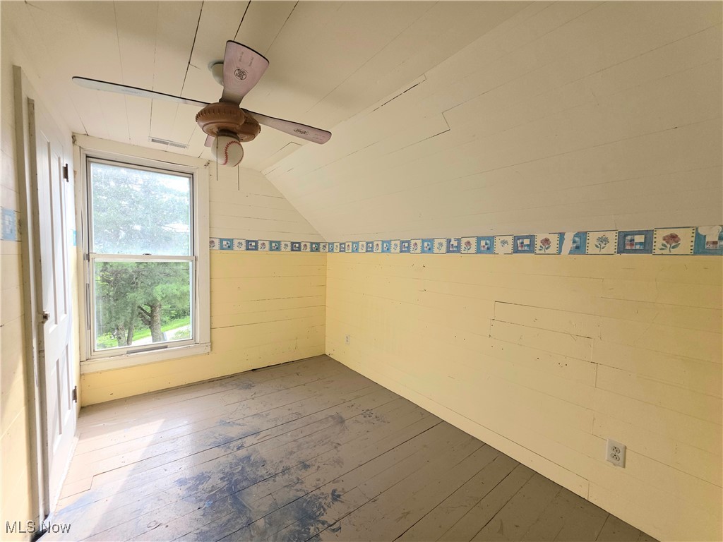 10 Browns Ridge Road Rockport, WV 26169 - Photo 17 of 35 Unfurnished room featuring hardwood / wood-style floors, a ceiling fan, and lofted ceiling