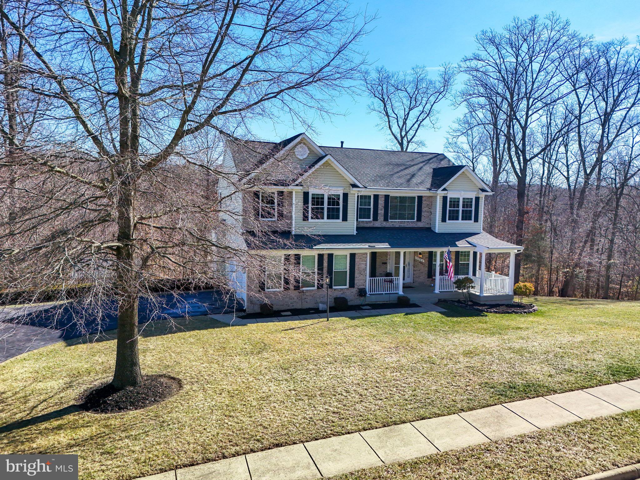 a house that has a tree in front of it