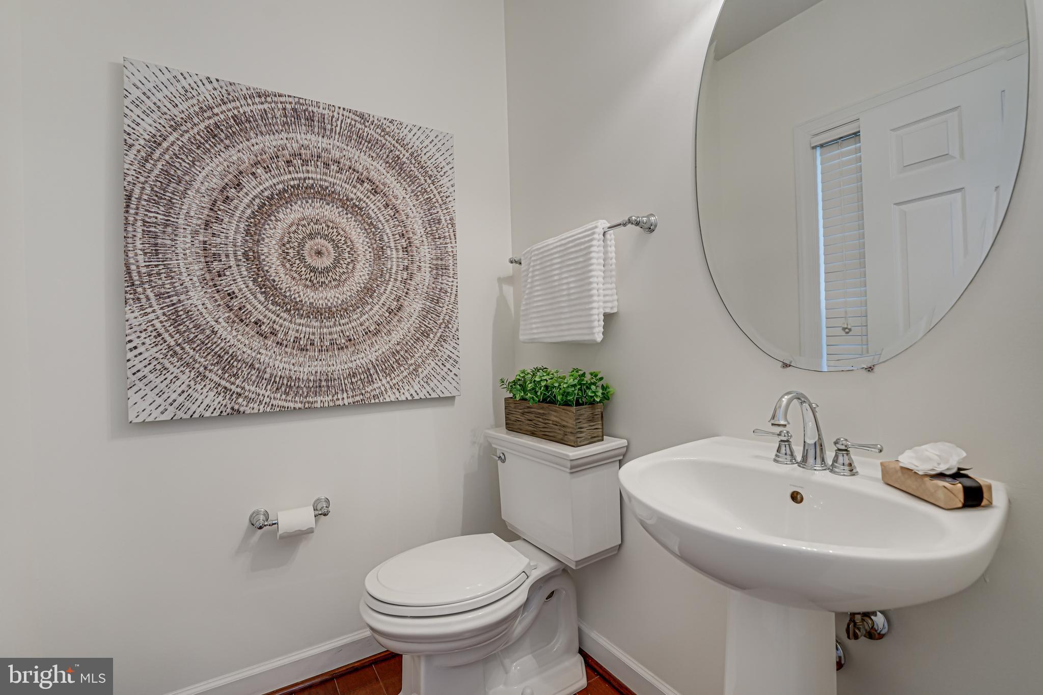 17583 Summer Duck Drive Dumfries, VA 22026 - Photo 18 of 49 a bathroom with a sink and mirror with toilet