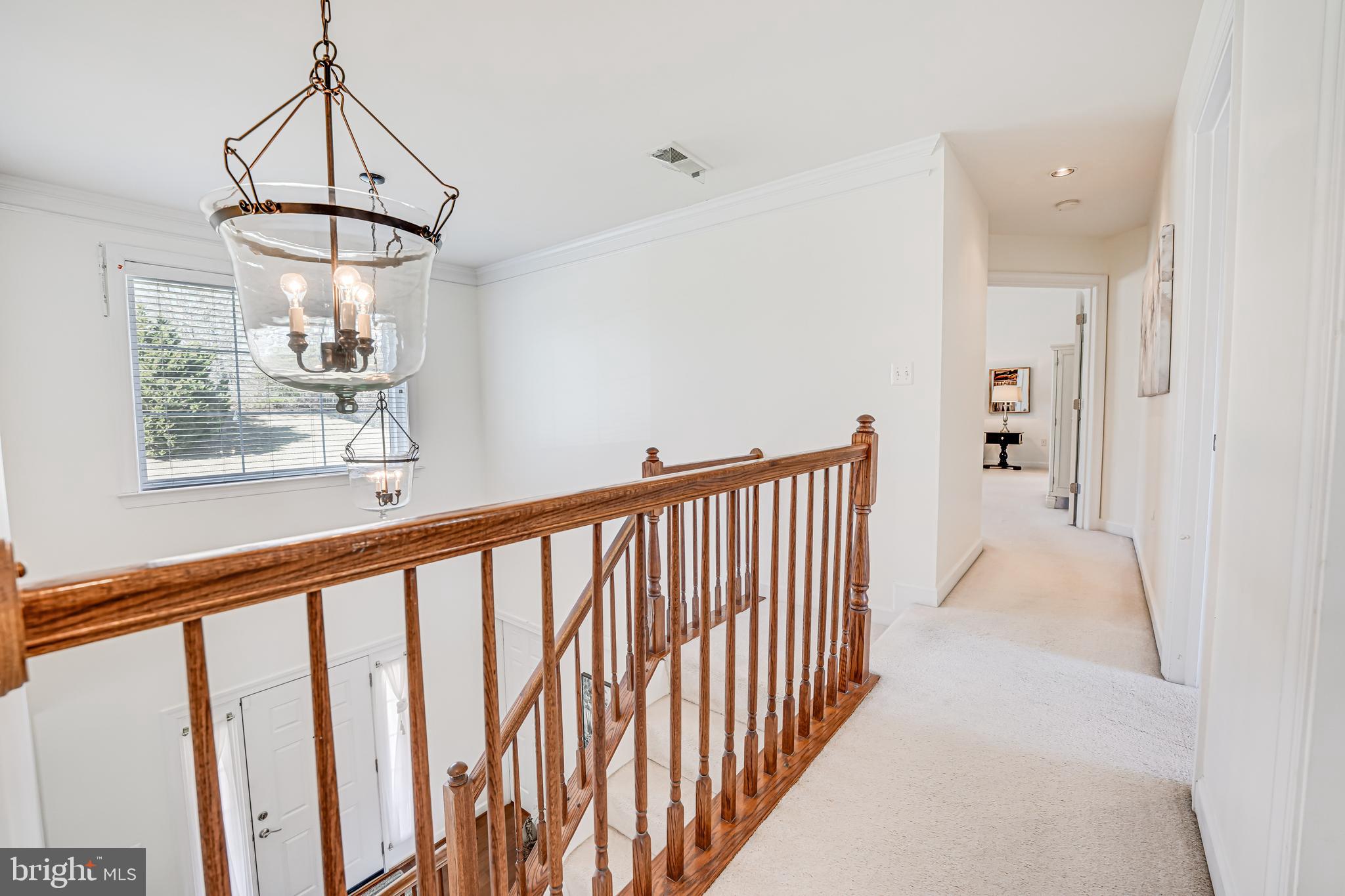17583 Summer Duck Drive Dumfries, VA 22026 - Photo 22 of 49 a view of a hallway with a chandelier