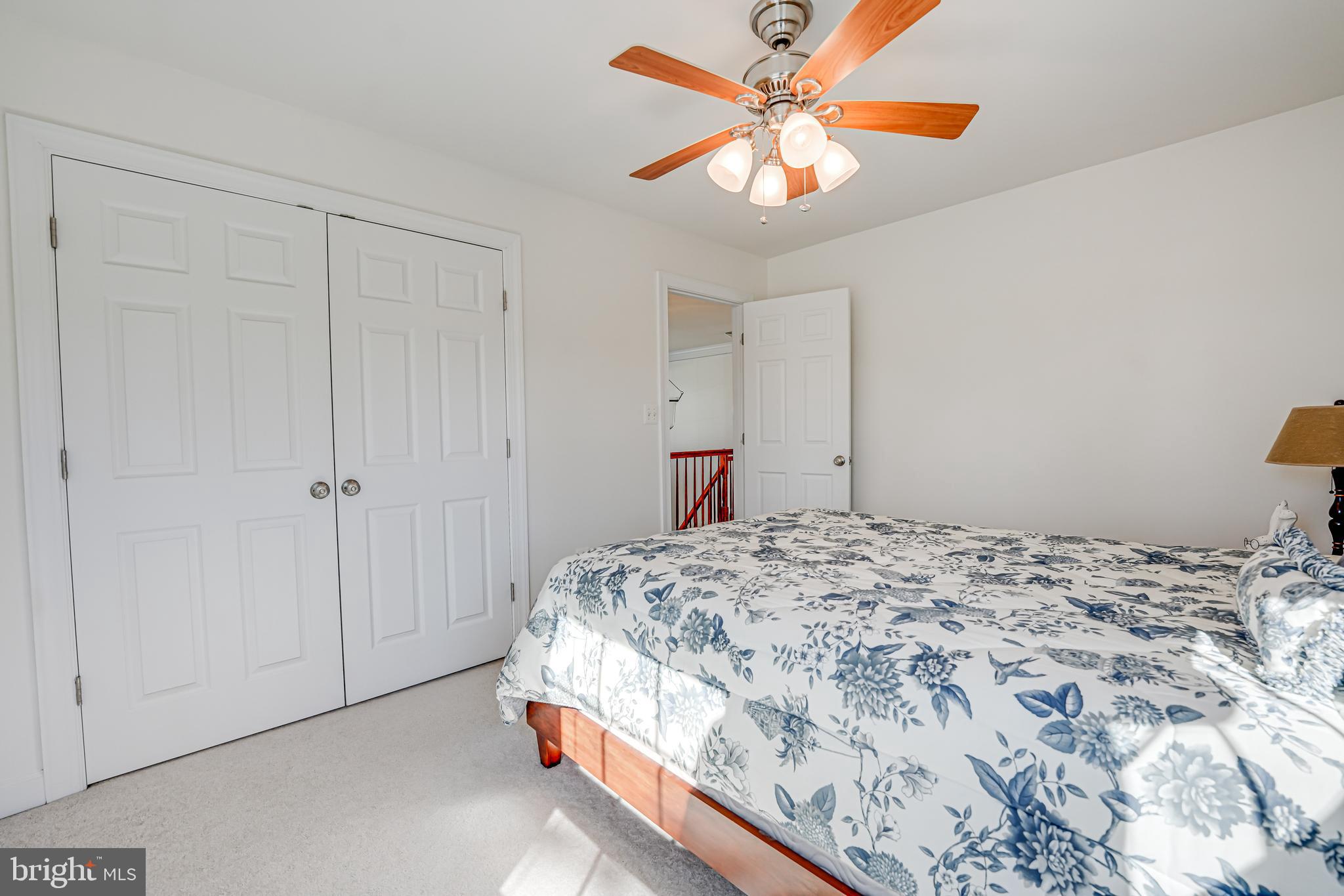 17583 Summer Duck Drive Dumfries, VA 22026 - Photo 23 of 49 a bedroom with a bed and a chandelier