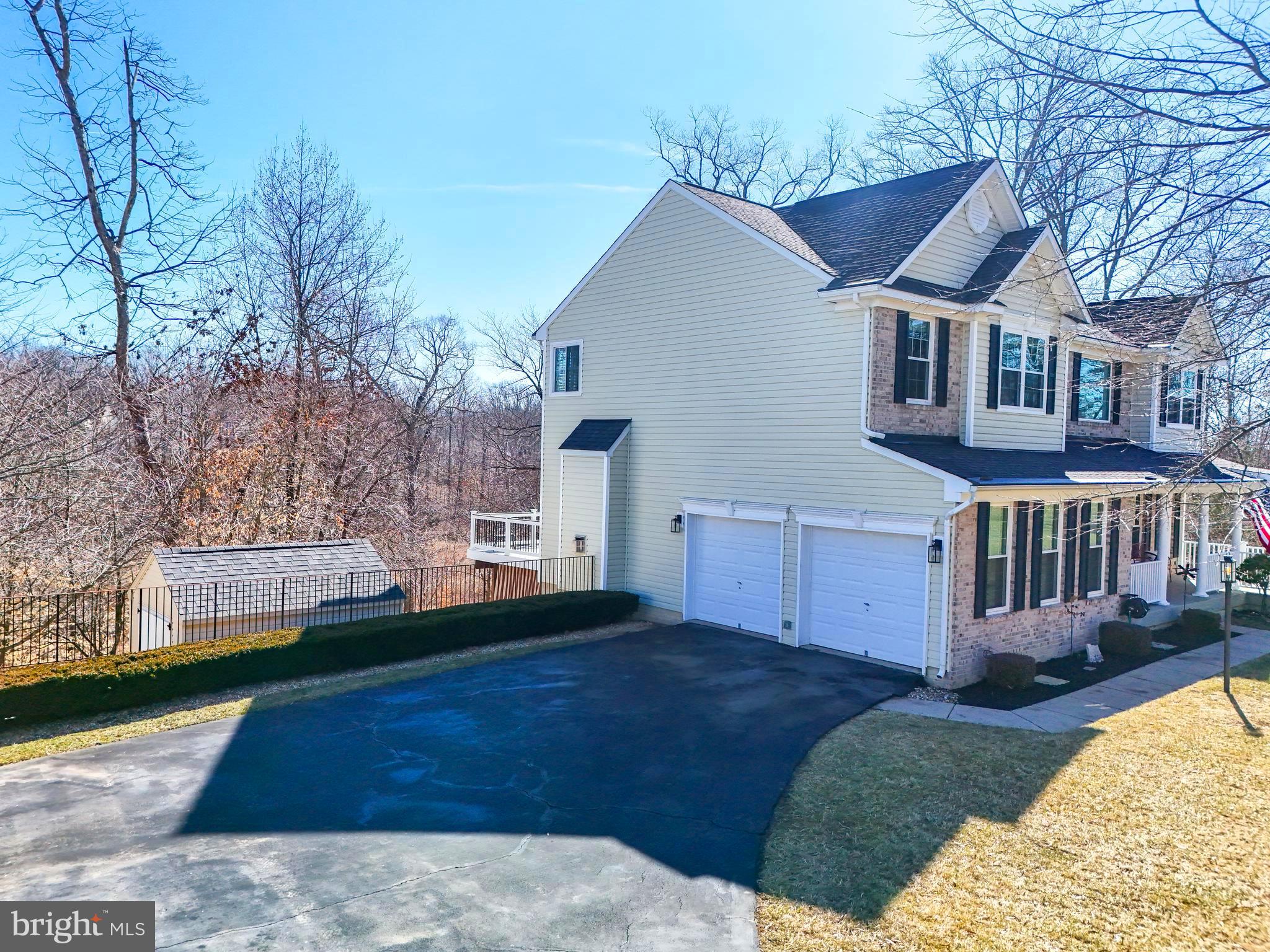 17583 Summer Duck Drive Dumfries, VA 22026 - Photo 5 of 49 a front view of a house with a yard and trees