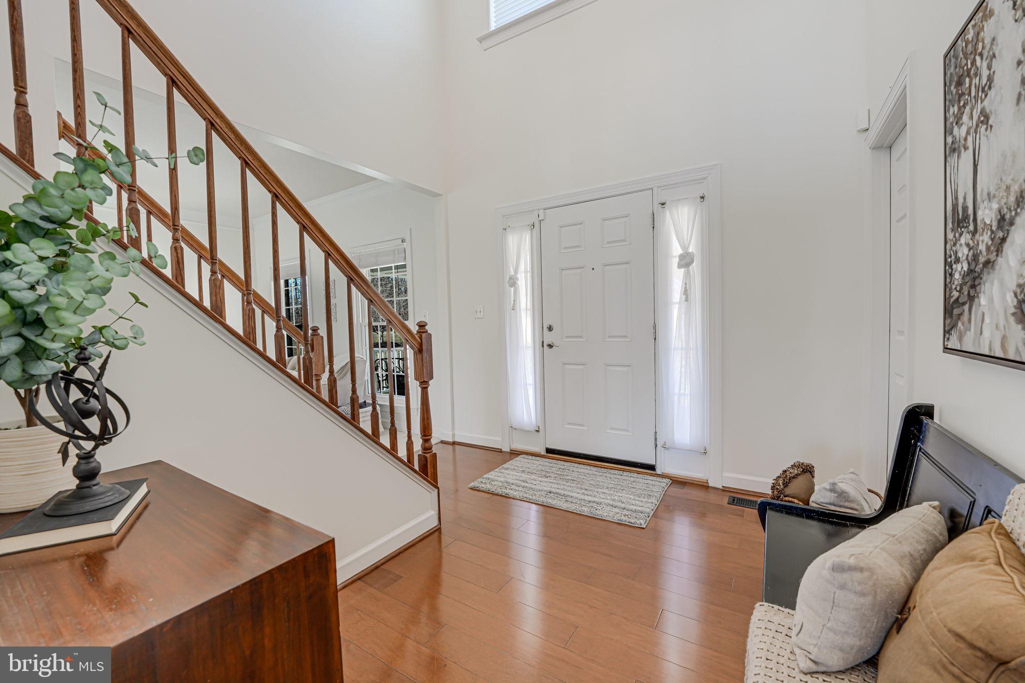 17583 Summer Duck Drive Dumfries, VA 22026 - Photo 6 of 49 a view of entryway and hall with wooden floor