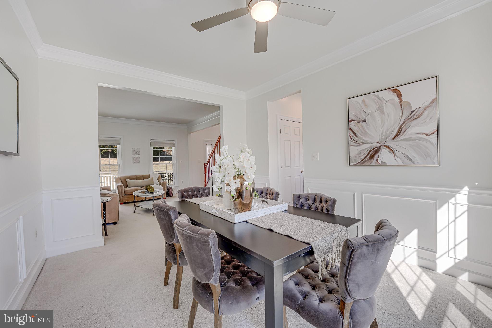 17583 Summer Duck Drive Dumfries, VA 22026 - Photo 8 of 49 a view of a dining room with furniture and wooden floor