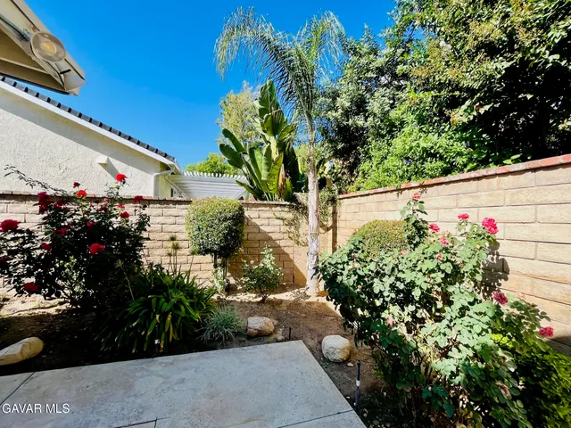 an aerial view of a tennis ground and a swimming pool