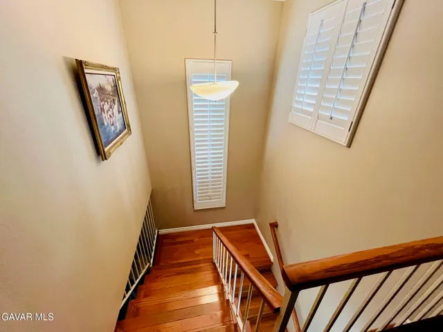 a view of a hallway with windows