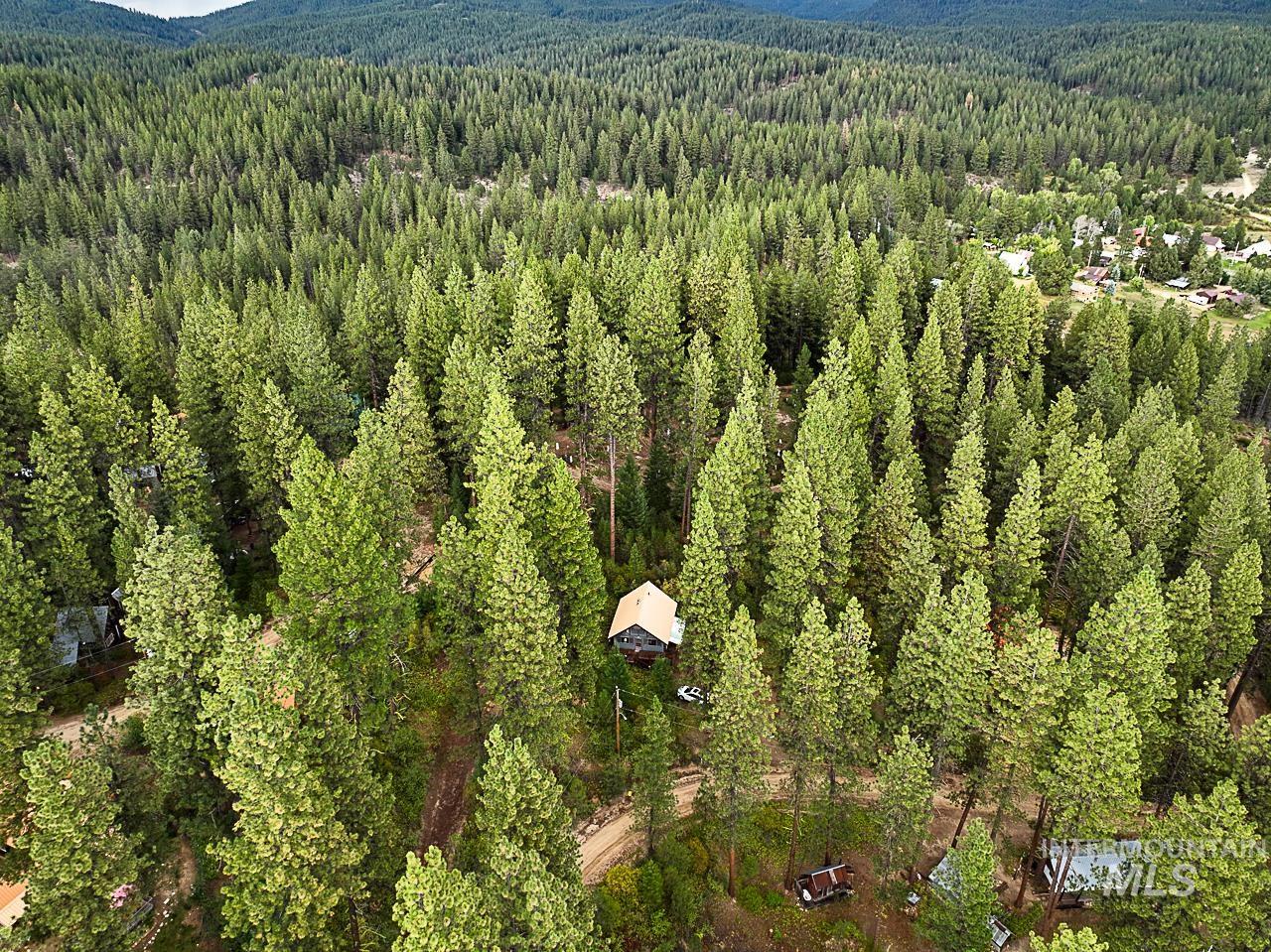 225 Mesplie Road Placerville, ID 83666 - Photo 2 of 39 Bird's eye view of a heavily wooded area
