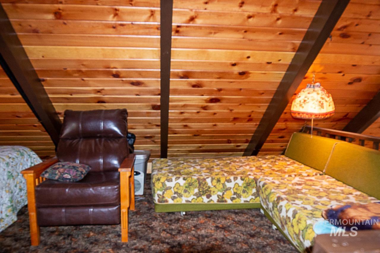 225 Mesplie Road Placerville, ID 83666 - Photo 24 of 39 Bedroom with wooden ceiling and carpet