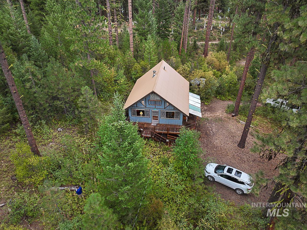 225 Mesplie Road Placerville, ID 83666 - Photo 3 of 39 View from above of property with a heavily wooded area