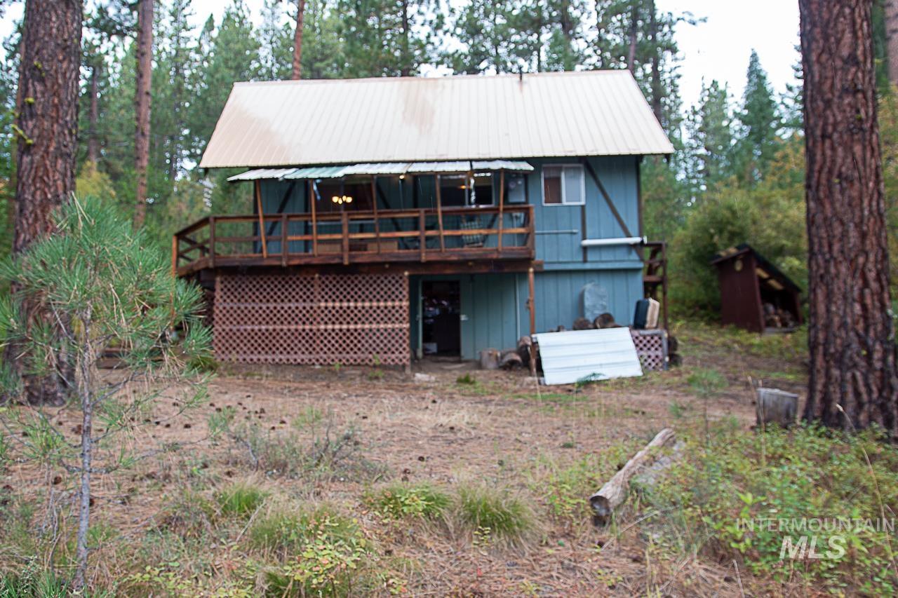 225 Mesplie Road Placerville, ID 83666 - Photo 39 of 39 Back of property featuring a metal roof and a wooden deck
