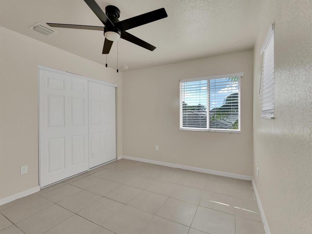 308 Northwest 17th Terrace Pompano Beach, FL 33069 - Photo 17 of 43 a view of an empty room with a window