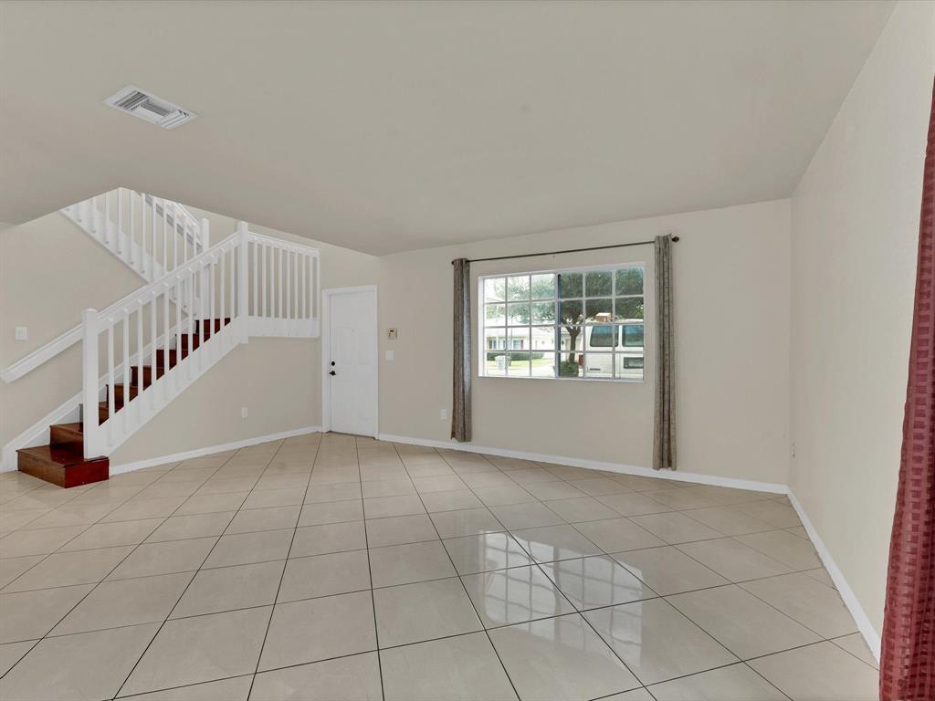 308 Northwest 17th Terrace Pompano Beach, FL 33069 - Photo 21 of 43 a view of an entryway with white walls