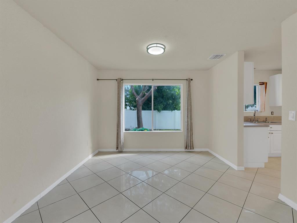 308 Northwest 17th Terrace Pompano Beach, FL 33069 - Photo 22 of 43 a view of an empty room with window