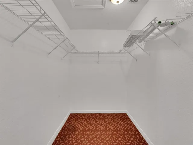 a view of a room with racks on the wall