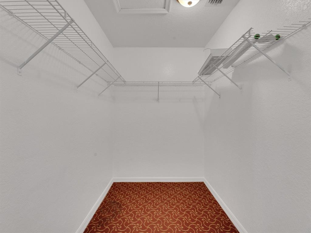 308 Northwest 17th Terrace Pompano Beach, FL 33069 - Photo 7 of 43 a view of a room with racks on the wall