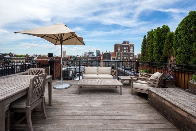 a view of a terrace with furniture